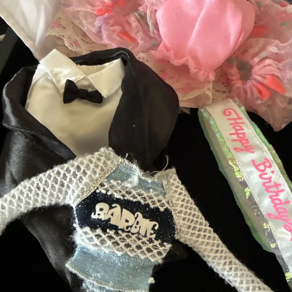 Lotof Barbie‎ doll clothesincluding 1 gown, o1 purse, a tuxedo Coat shirt, &more